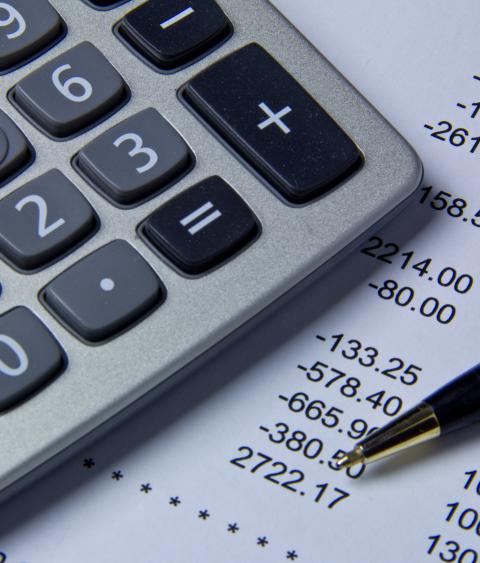 Calculator and a balance sheet