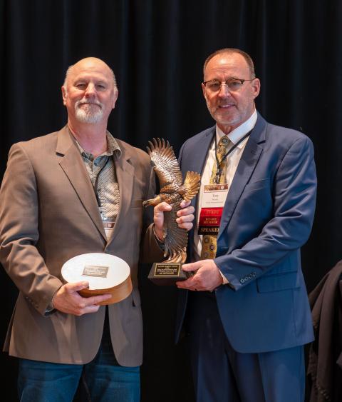 Jim Heffelfinger receiving Grinnell Award from Tony Wasley