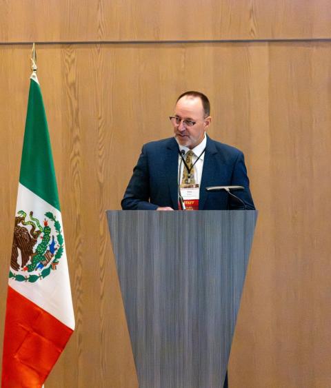 Tony Wasley delivering opening remarks at North American conference