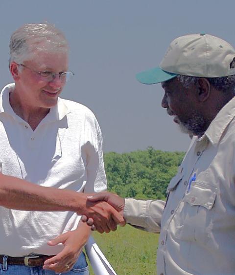 conservation collaborators shaking hands