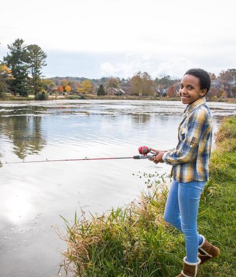 Girl fishing on Virginia riverbank