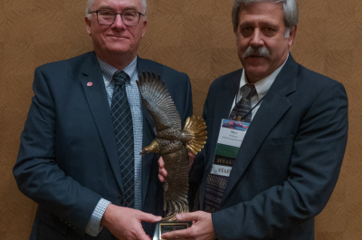 Daniel Decker receiving George Bird Grinnell award from Steve Williams