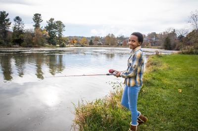 Girl fishing on Virginia riverbank