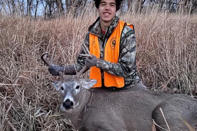 Tyler posed with his first buck