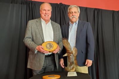 Steve Williams presents Grinnell Award to Charles Wooley