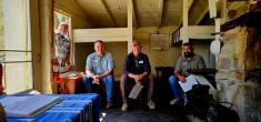 Buddy Huffaker, Richard Heilbrun, Michael Crowell, and JJ Apodaca inside the Aldo Leopold's Shack