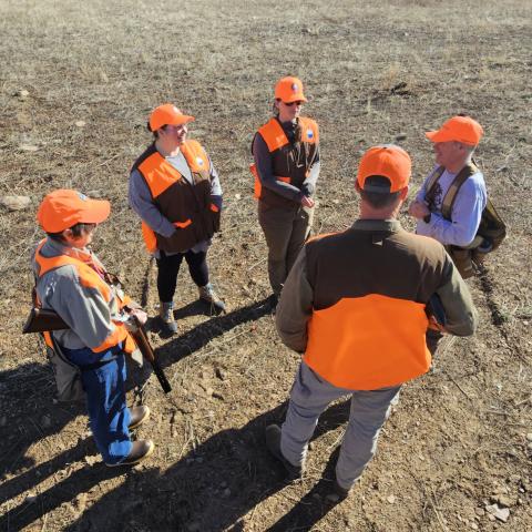 Students getting firearm safety instruction in the field