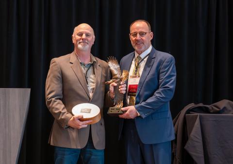 Jim Heffelfinger receiving Grinnell Award from Tony Wasley