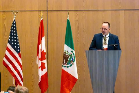 Tony Wasley delivering opening remarks at North American conference