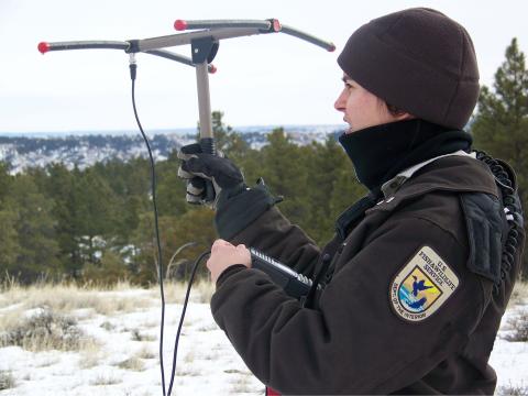 A USFWS Biologist holding telemetry antenna