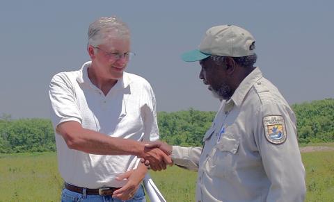conservation collaborators shaking hands