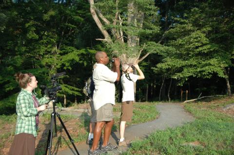 Dr. Drew Lanham birdwatching with others