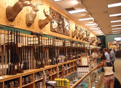 Gun store service desk and customers