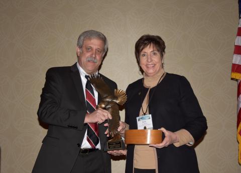 Rebecca Humphries receiving the Grinnell Award from Steve Williams