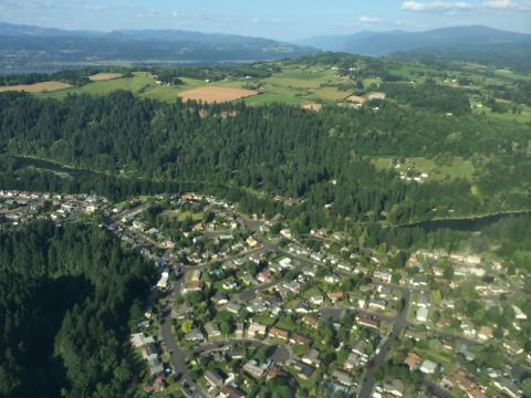 Aerial photo of the Sandy River in Oregon separating urban and rural areas