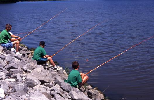 A trio of anglers on the riverbank