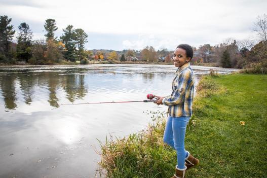 Girl fishing on a Virginia riverbank